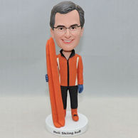 Handsome man surfer bobblehead orange surfboard