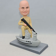 Personalized soldier bobblehead right leg on the grey boat