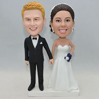 White dress and black suit wedding bobblehead with white and navy blue bouquet
