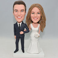 Happy wedding bobblehead with white dress and bouquet on bridge hand