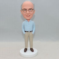 Personallized blue shirt bobblehead with his hands inside the pocket