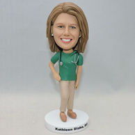 Custom bobbleheads in green shirt and a plaid pants