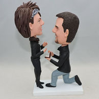 Custom bobbleheads for who is proposing with a finger ring