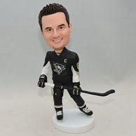 Hockey players custom bobbleheads with a stick