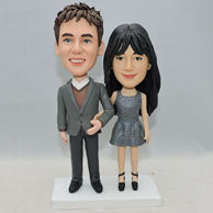 Sweet couple bobblehead with arm in arm