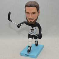 Custom skate man bobblehead holding skating pole