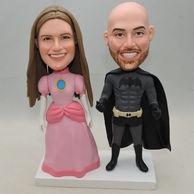 Custom Couple Bobbleheads in superhero clothes and pink dress