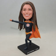 Peronalized superwoman bobbleheads who wears black dress and orange cape