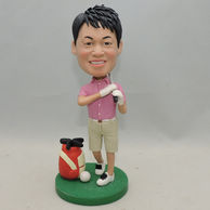 Persoanzlied man golf player bobblehead doll with tan shorts