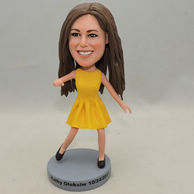 Beautiful girl bobblehead with yellow dress