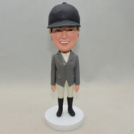 Custom-made lady bobbleheads with black hat, gray jacket