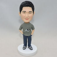 Thoughtful man bobblehead with hands in pants pocket