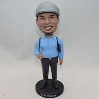 Self-confident man bobblehead with blue shirt