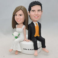Couple bobblehead wife with white trapeze dress & husband with black suit