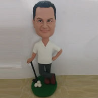 Custom-made golfer bobblehead with golf & golf club