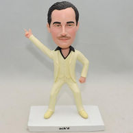 Man bobblehead in light yellow suit with double-fold eyelids