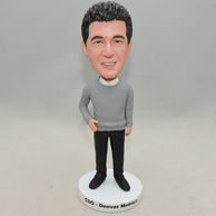 Handsome male bobblehead in grey sweater