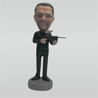 Custom man and gun bobble heads