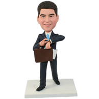 Custom mature men in dark blue business suit with light blue tie having a brief case in hand bobble heads