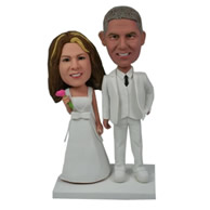 Custom wedding cake topper of both bride and groom dressing in white bobble heads