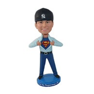 Custom creative male pulling outside the supper men logo underneath bobble heads