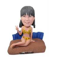 Custom retired women in bikini happily lying in the beach bobble heads