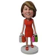 The woman dressed in a red dress bought four bags of goods custom bobbleheads
