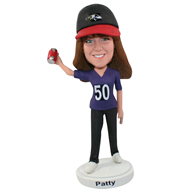 The woman is wearing a hat custom bobbleheads