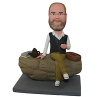 The man sat down on a stone custom bobbleheads