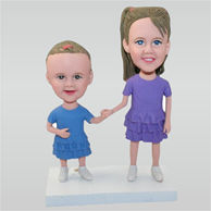 Little girl in purple dress and little girl in blue dress custom bobbleheads