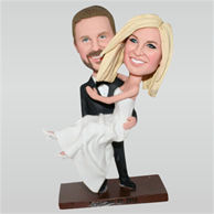 Groom in black suit carrying bride in white wedding dress custom bobbleheads