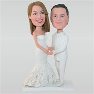 Groom in white suit and bride in white wedding dress custom bobbleheads