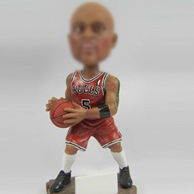 Basketball player bobble head doll