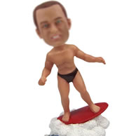 Bobble head doll of surfing