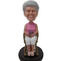 Custom bobbleheads of in chair