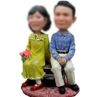 Custom Couple sitting on the sofa bobbleheads