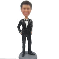 Man in black suit bobble head doll