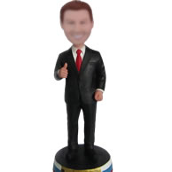 Man in black suit bobble head doll