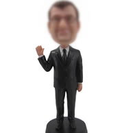 Man in black suit bobbleheads