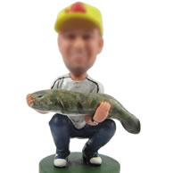 Man with big fish bobbleheads