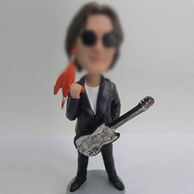 Guitarist bobble head doll