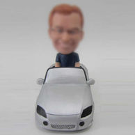 Man  bobble head doll with car