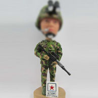 Bobble head doll  man with gun