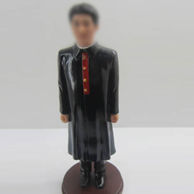 Pastor bobble head doll