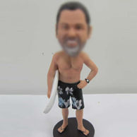 Surfing bobble head doll