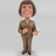 Woman in suit bobble head doll